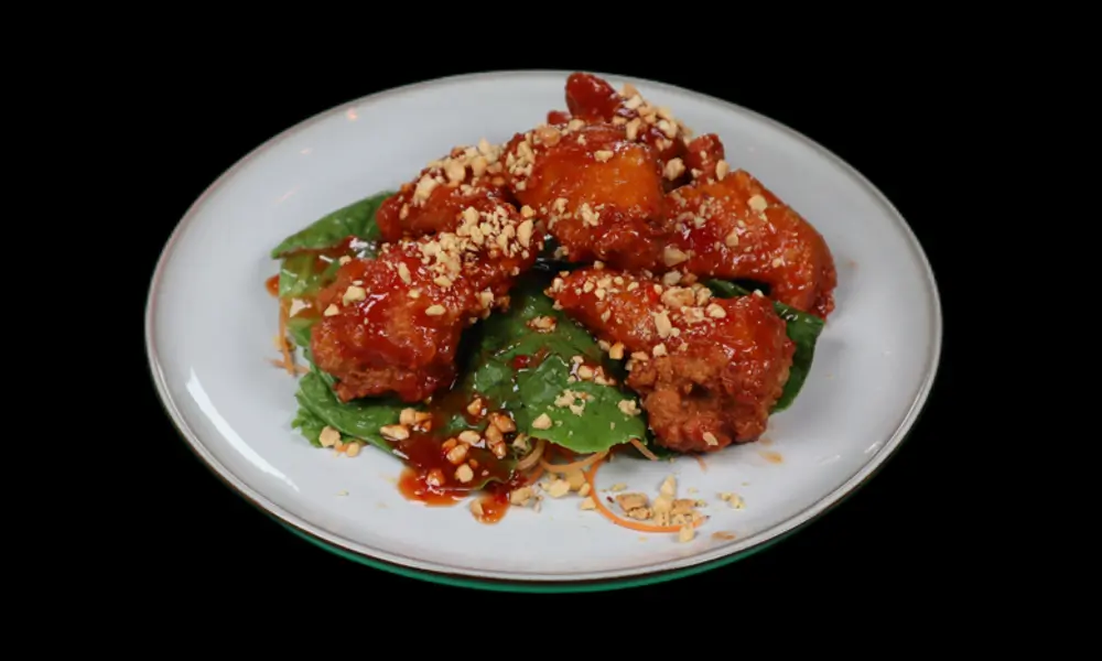 Thai - flavored chicken wings, unique seasoning, delicate arrangement at Sushi Lee, a Japanese restaurant in Brooklyn